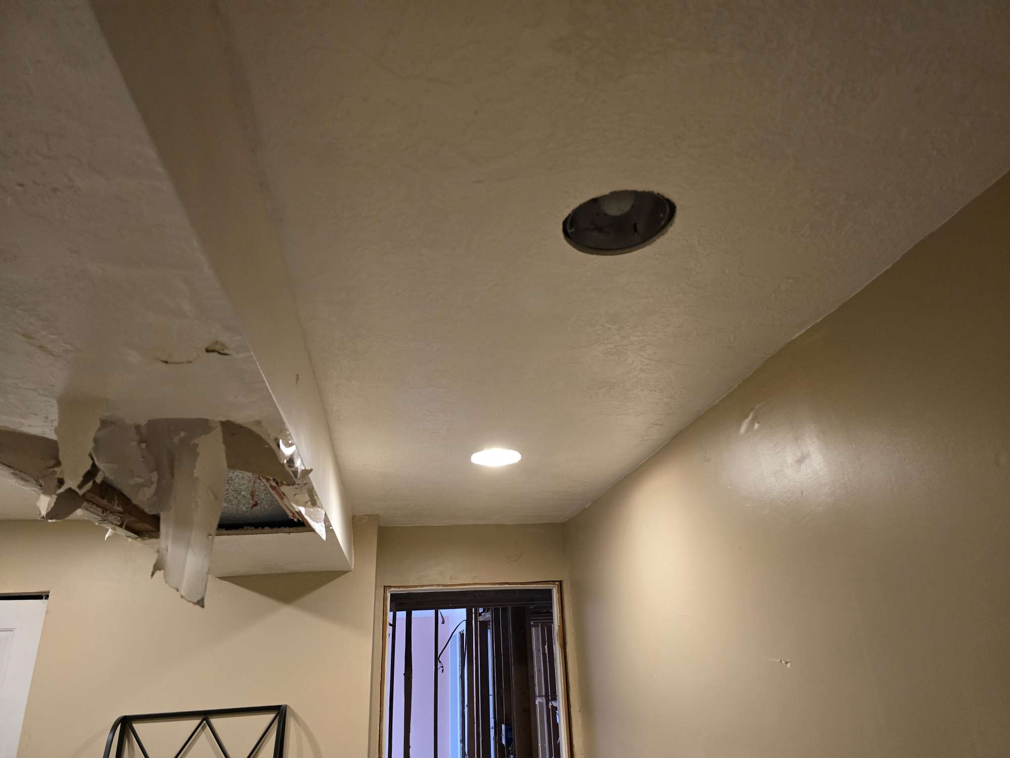 Kitchen with fire and smoke damage on ceiling and cabinets